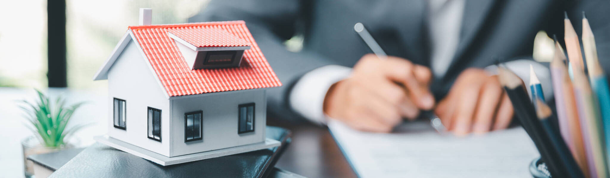 Business Woman Or Lawyer Accountant Working Financial Investment On Office. Insurance Protective Hand Over House For Protection And Care, Concept Of Home And Real Estate Property Insurance.